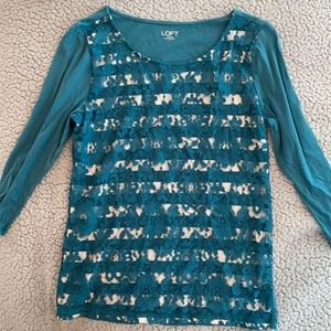 Teal green 3/4 sleeve shirt with lace detail.